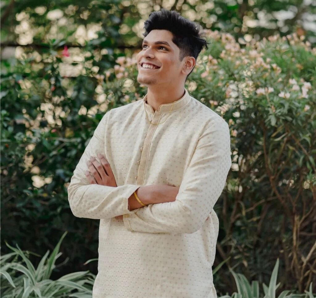 Mithilesh Patankar in the off white sexy kurta while smiling towards camera