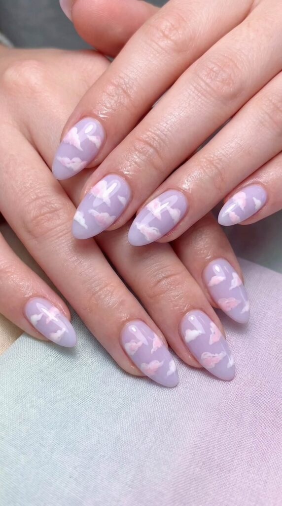 Dreamy lavender cloud nail art with soft pink undertones on almond-shaped nails