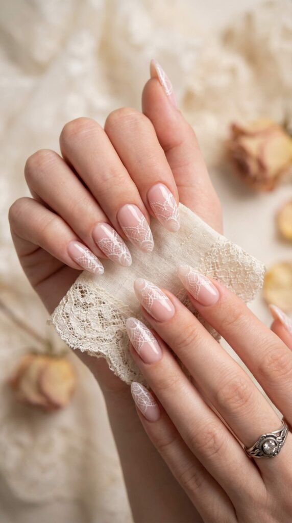 Romantic white lace pattern nail art on sheer nude almond nails