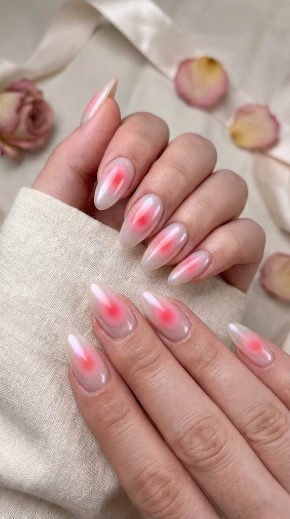 Trendy aura blush nails with soft pink gradient on milky white base
