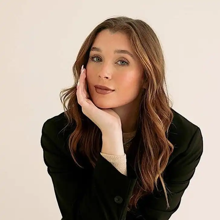 Marissa Layne Lawrence in the black captivating outfit pair with elegant jewellery while looking towards camera