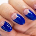 Round shape short nails with blue nail paint are appearing attractive