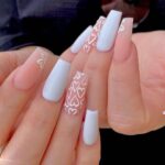 eye-catching long square nails with beautiful heart nail art using white and pink nail paint