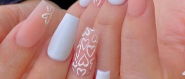 eye-catching long square nails with beautiful heart nail art using white and pink nail paint