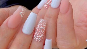 eye-catching long square nails with beautiful heart nail art using white and pink nail paint