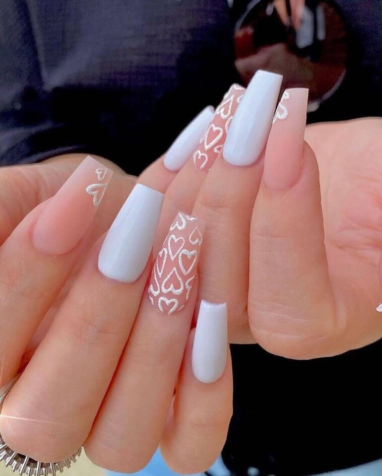 eye-catching long square nails with beautiful heart nail art using white and pink nail paint