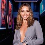 Madelyn Cline in the sexy grey outfit pair with chain watch while smiling towards camera