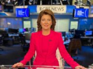 Norah O'Donnell in the pink sexy outfit and brown shoes while poses for a photo